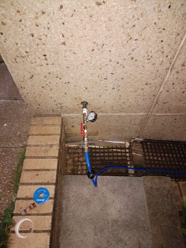 Pipe inspection equipment on a paved work area