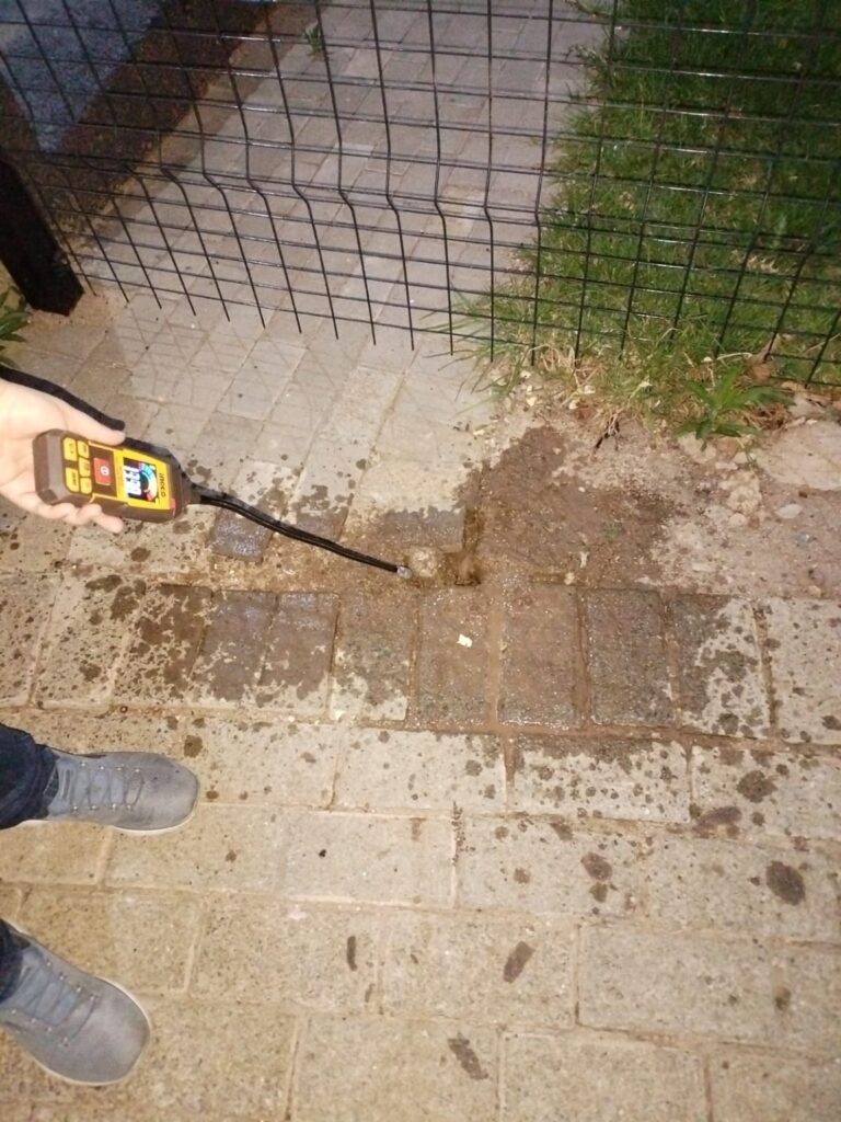 Inspection instrument beside exposed pipework
